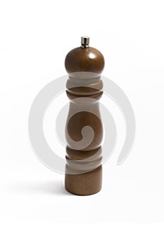 Wooden pepper grinder on white
