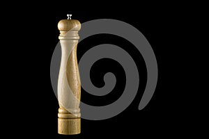 Wooden Pepper Mill on a Black Background