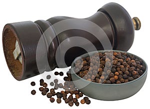 Wooden pepper mill with black pepper