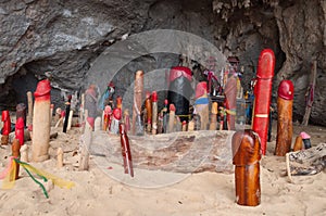 Wooden phalluses in Princess cave. Railay. Thailand