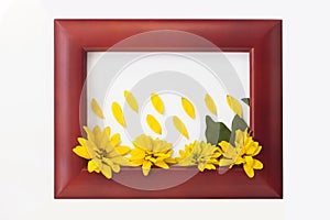 Wooden photo frame with yellow flowers on a white background. Hello autumn concept