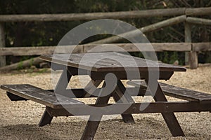 Wooden pick nick table in natural park Sierra Helada near El Albir, Spain