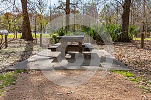 Wooden Picnic table and benches at Hermann Park Houston Texas USA