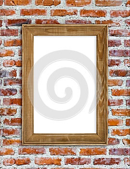 Wooden picture frame hanging on red brick wall