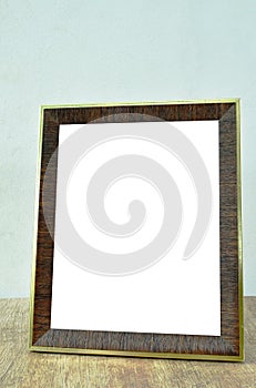 Wooden picture frame on table