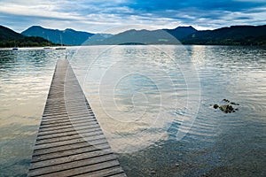 Wooden pier in the beach of Tegernsee lake in Germany