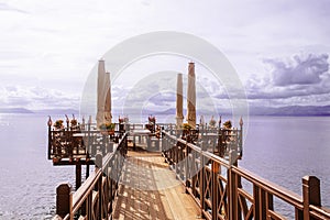 Wooden pier with cafe in Ionian sea. Greece.