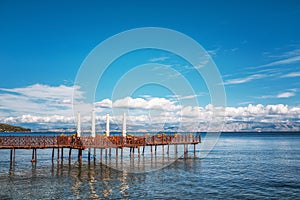 Wooden pier with cafe in Ionian sea. Greece.