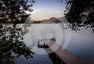 Wooden pier at Canto da Lagoa area of Lagoa da Conceicao - Florianopolis, Santa Catarina, Brazil photo