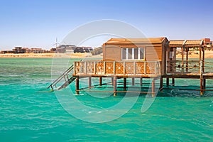 Wooden pier with change room house on Red Sea