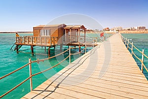 Wooden pier with change room house on Red Sea