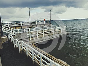 Wooden pier on cloudy day