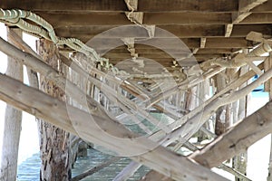 Wooden pier on coast of Paradise island of Red Sea