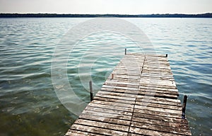 Wooden pier at Drawsko lake, maximum depth of 80 m makes it the second deepest lake in Poland