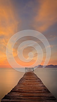 Wooden pier / jetty, playa de muro, Alcudia, sunrise, mountains, secluded beach, golden sunlight, reflection, beautiful sky, photo