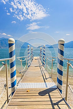 Wooden Pier on Lake Como, Beautiful Mountain On Background, Lake Como, Lombardia, Italy