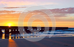 Wooden pier of Lido di Jesolo resort on sunrise Veneto Italy