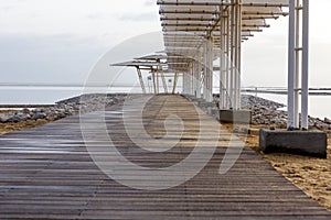 Wooden pier at morning at Dead Sea