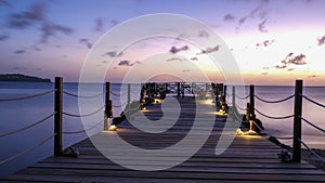 wooden pier in the ocean during sunset at Saint Lucia or St Lucia Caribbean