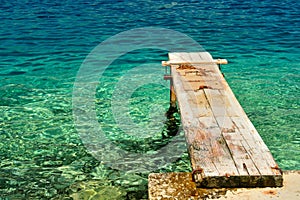 Wooden pier over beautiful adriatic sea. Korcula, Croatia