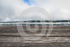 Wooden pier overlooking the morning landscape with autumn fog over Lake Massawippi, Sunrise with fog over the lake and