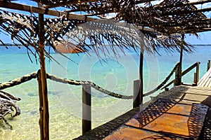 Wooden pier at Pangaimotu island near Tongatapu in Tonga photo