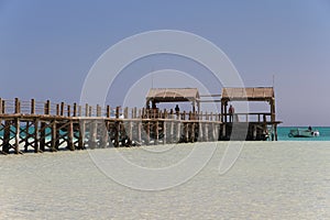 Wooden pier on Paradise island and a boat