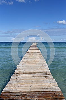 A wooden pier at Playa de Muro beach in Mallorca