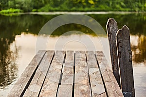 Wooden pier on the river. Descent to the water