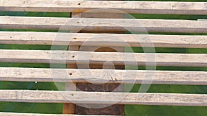 Wooden pier in the sea close-up with clear blue water under it.