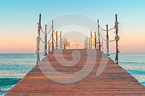 Wooden pier sea front view sunrise dawn time