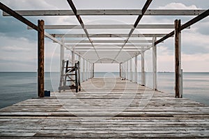 Wooden pier and sea, perspective, corridor view with no people