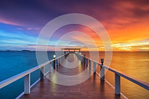 Wooden pier between sunset