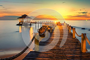 Wooden pier between sunset in Phuket, Thailand.