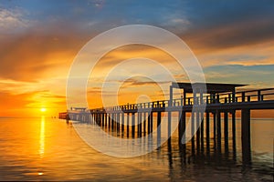 Wooden pier between sunset in Phuket, Thailand.