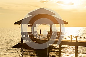 Wooden pier between sunset in Phuket, Thailand.