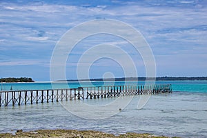 Wooden pier in a tropical beach in maratua island