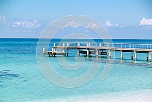 Wooden Pier into Turquoise Caribbean Sea waters