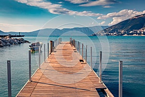 Wooden pier in Vlore port. Calm spring seascape of Adriatic sea. Wonderful outdoor scene of Albania, Europe.