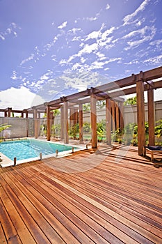 Wooden pillar and beam with a floor area pool side