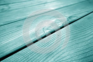 Wooden pine board surface with blur effect in cyan tone