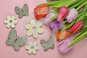 Wooden pink empty copy space spring background with colorful tulips in the corner