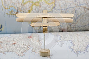 Wooden plane made with ice cream sticks and a wooden clothespin photo