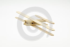 Wooden plane made with ice cream sticks and a clothespin photo