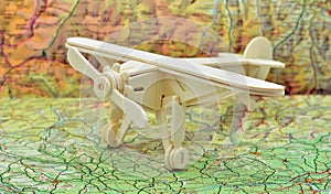 Wooden plane on a map photo