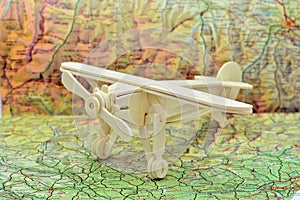 Wooden plane on a map photo