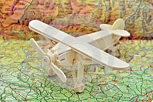 Wooden plane on a map photo