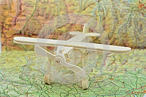 Wooden plane on a map photo