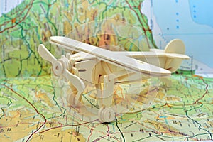 Wooden plane on a map photo