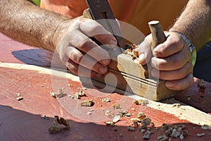 Wooden planer, table from old wood, a natural building material, handcrafted wood, ancient hand tools, carrying out carpentry, joi